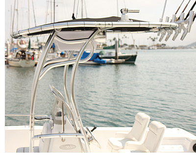 Shows a t-top upgraded with rod holders, e-box, lights and outrigger mounts